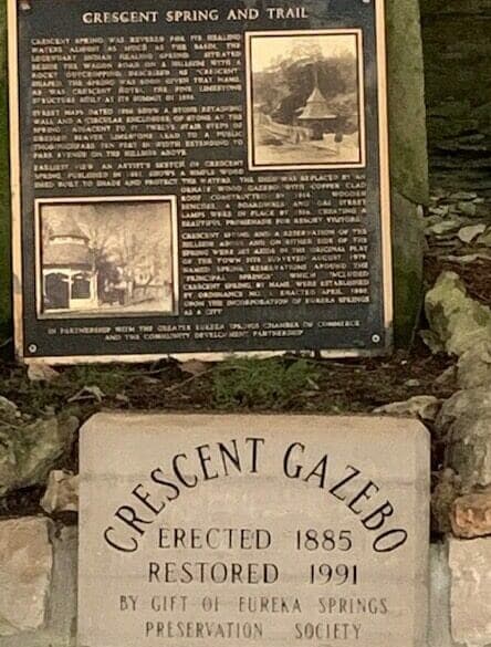 A historical plaque detailing the Crescent Spring and Trail, along with a stone marker for the Crescent Gazebo, erected in 1885 and restored in 1991.