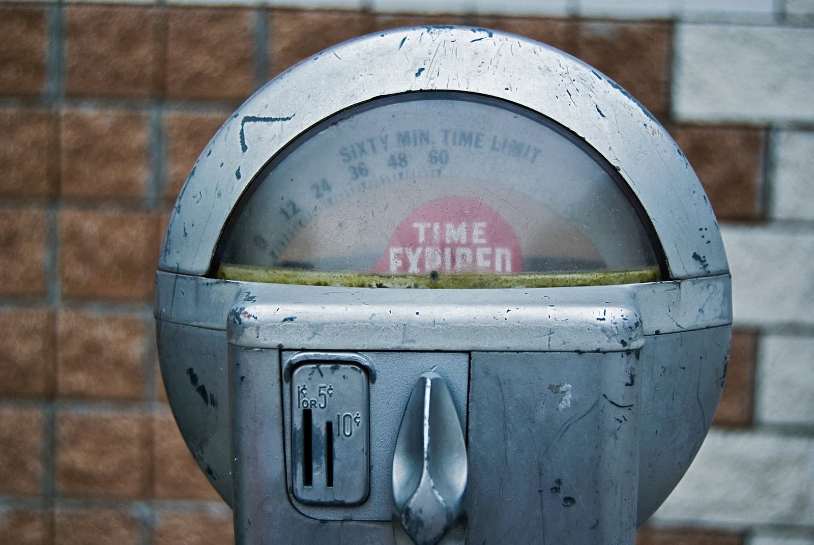 A close-up of a parking meter displaying "TIME EXPIRED."