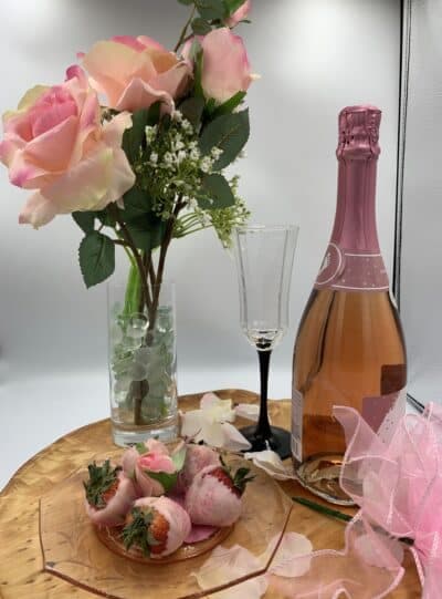 Pink flowers, wine, and chocolate